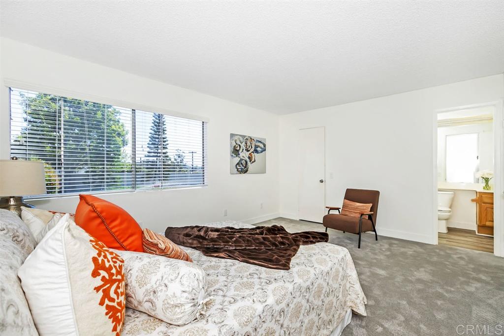 7855 Hummingbird Lane San Diego, CA 92123 - Photo 10 of 25 Extra large master bedroom features a walk-in closet and direct access to the bathroom.
