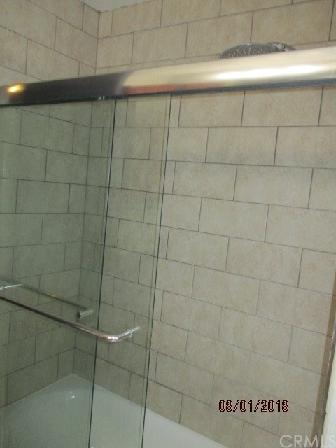 2015 Bataan Road, Unit 105 Redondo Beach, CA 90278 - Photo 10 of 15 Full updated tiled tub/shower combination with glass enclosure.