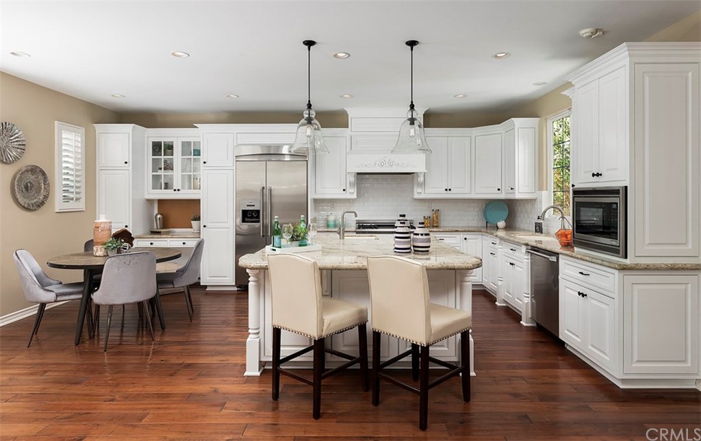 20 Winfield Drive Ladera Ranch, CA 92694 - Photo 10 of 47 Gorgeous Entertainers Kitchen with white wood cabinets and white subway tile back splash ~