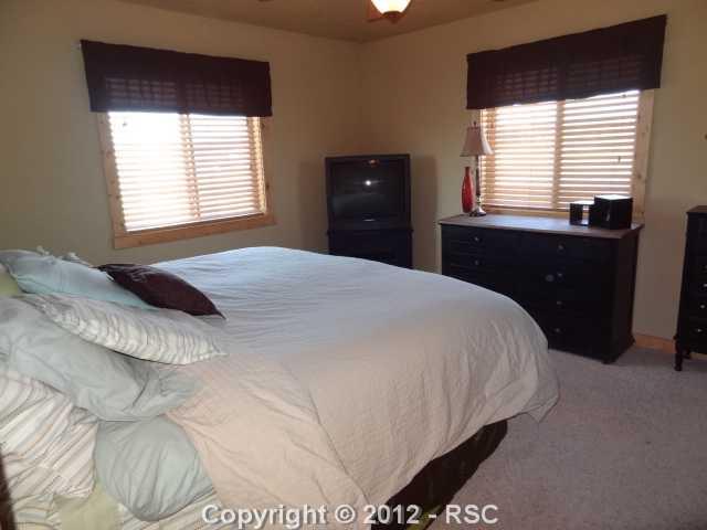 29 Ridge Point Circle Divide, CO 80814 - Photo 8 of 16 Matser bedroom accomodates a king sized bed with ease, and has two closets for his and hers space