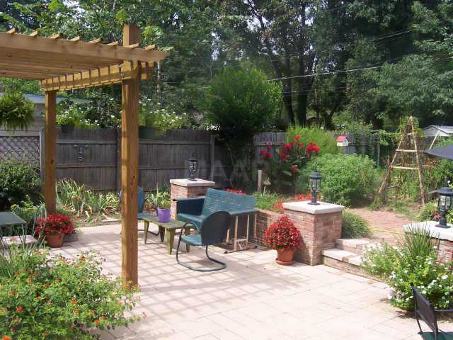 3704 Walnut Grove Road Memphis, TN 38111 - Photo 4 of 10 Beautiful Pergola w/new stone patio, flower & veg.gardens + shed in backyard