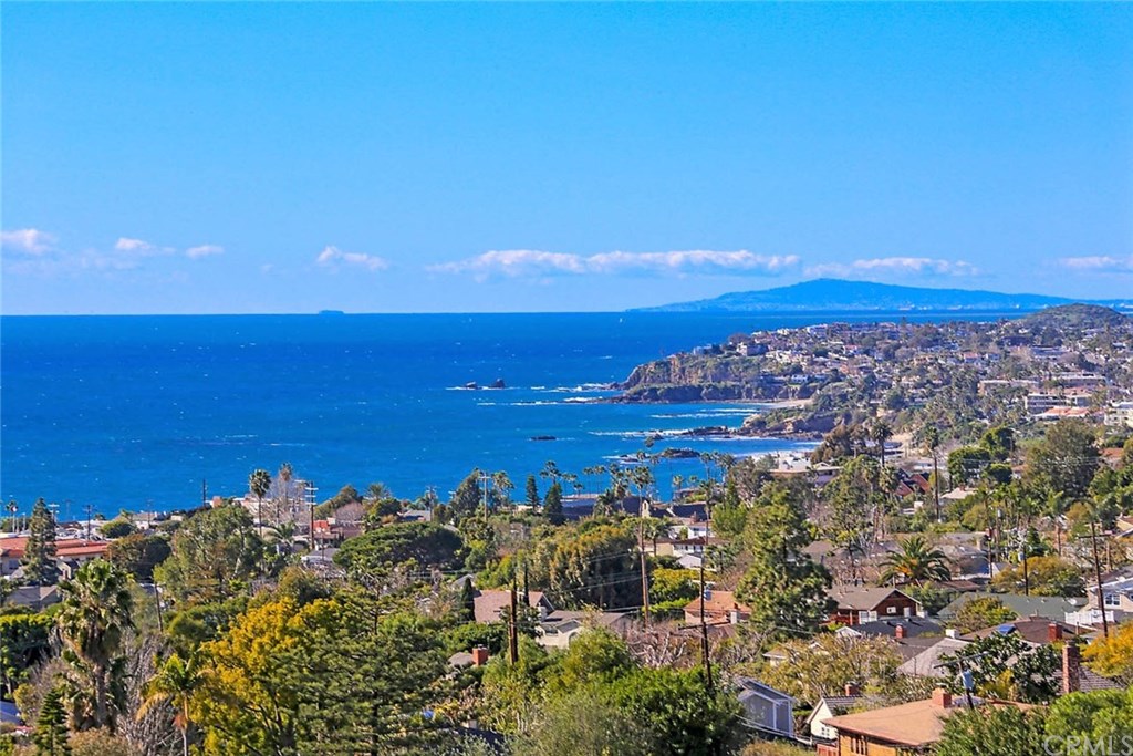 Incredible coastline and sunset views from most rooms of this immaculate custom home!