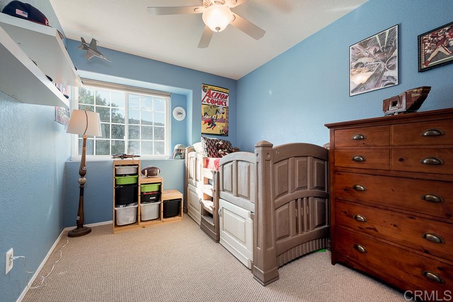 9251 Sombria Road Lakeside, CA 92040 - Photo 17 of 25 Secondary bedroom- ceiling fan and oversized window ledge for trinkets and such...