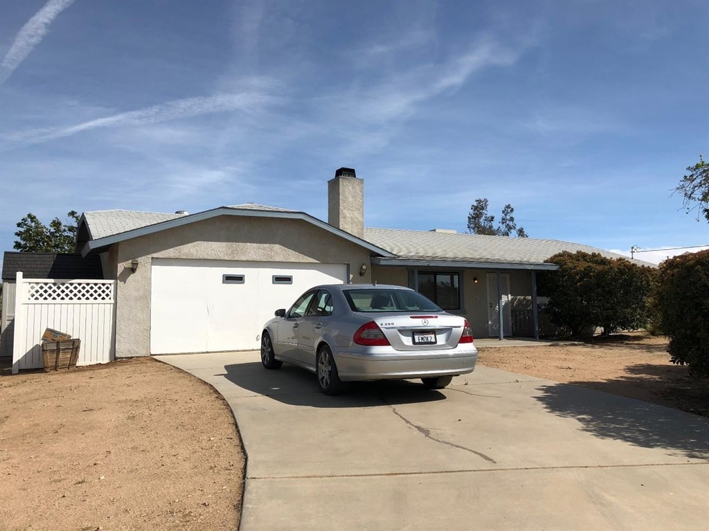 6829 Juniper Road Phelan, CA 92371 - Photo 1 of 1 Front of your new home! You'll have to share with the three doves that reside here!