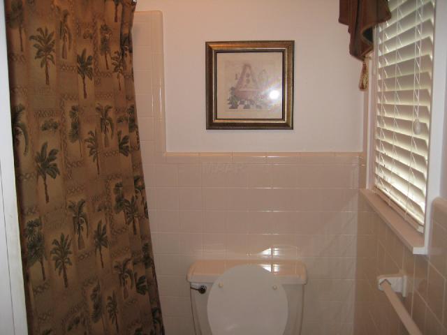 5481 Gwynne Road Memphis, TN 38120 - Photo 7 of 10 The rest of the hall bath showing the tub, shower and water closet area separate from the vanity area.