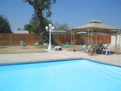 5924 Norris Road Bakersfield, CA 93308 - Photo 5 of 20 THE POOL IS QUITE LARGE AND IT WOULD REALLY BE NICE TO COOL OFF OUR HOT BAKERSFIELD DAYS