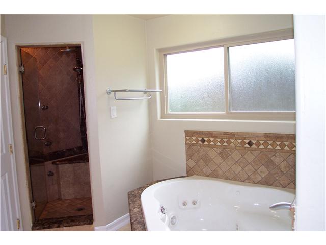 13250 Vinter Way Poway, CA 92064 - Photo 12 of 20 Walk-in shower has one hand held shower and another rain shower head, with 6 body sprays.
