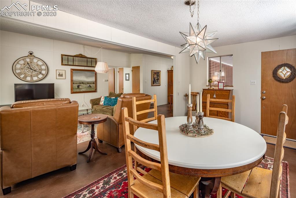 8715 Chipita Park Road Cascade, CO 80809 - Photo 10 of 33 Additional view of entry and main room. Open and bright!