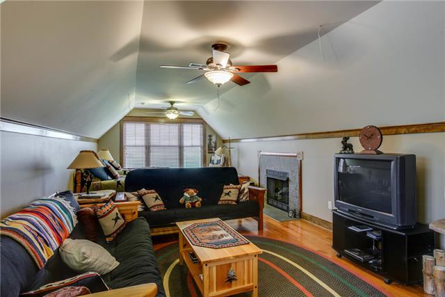 13920 Patterson Road College Grove, TN 37046 - Photo 19 of 30 Just over the garage with a private entrance is the 4th bedroom apartment. Studio layout includes a fireplace, sleeping are, living area, kitchen, and bath. There is also 700plus SF of expansive space above.