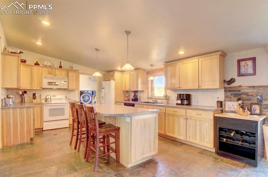 3235 South Meridian Road Colorado Springs, CO 80929 - Photo 14 of 36 Very nice kitchen with updated Hickory Cabinets