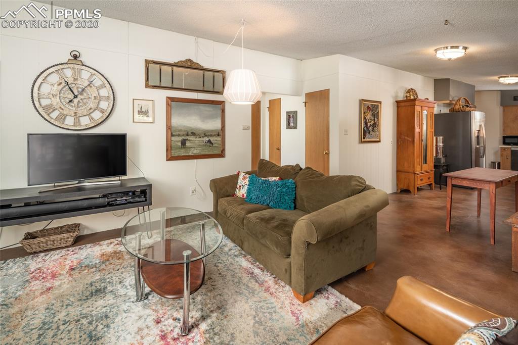8715 Chipita Park Road Cascade, CO 80809 - Photo 12 of 33 Main room and views of hallway that leads to a bedroom and 2nd bathroom.