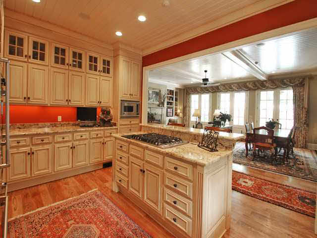 210 Waring Road Memphis, TN 38117 - Photo 9 of 25 Abundant light pours through three sets of French doors into the hearth room and kitchen. Wide open views to the fireplace and friends so that the chef can join in the conversation.