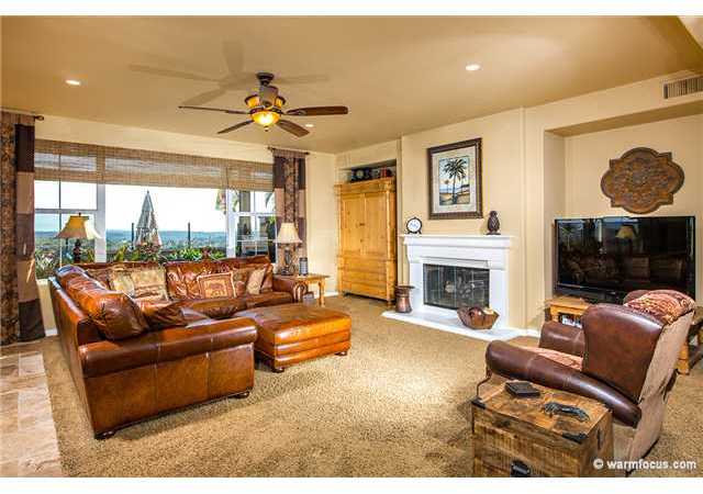 7603 Circulo Sequoia Carlsbad, CA 92009 - Photo 6 of 25 Large family room with a fireplace & views with doors to the backyard