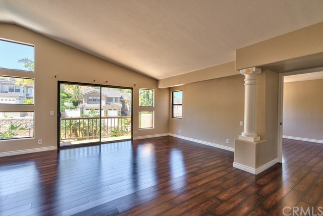 3086 Diamondview Circle Corona, CA 92882 - Photo 19 of 66 This is the opposite angle of the master bedroom. The room in the background through the Roman columns is the master retreat. The contemporary wood-laminate floors span through out the 2nd level and the staircase.