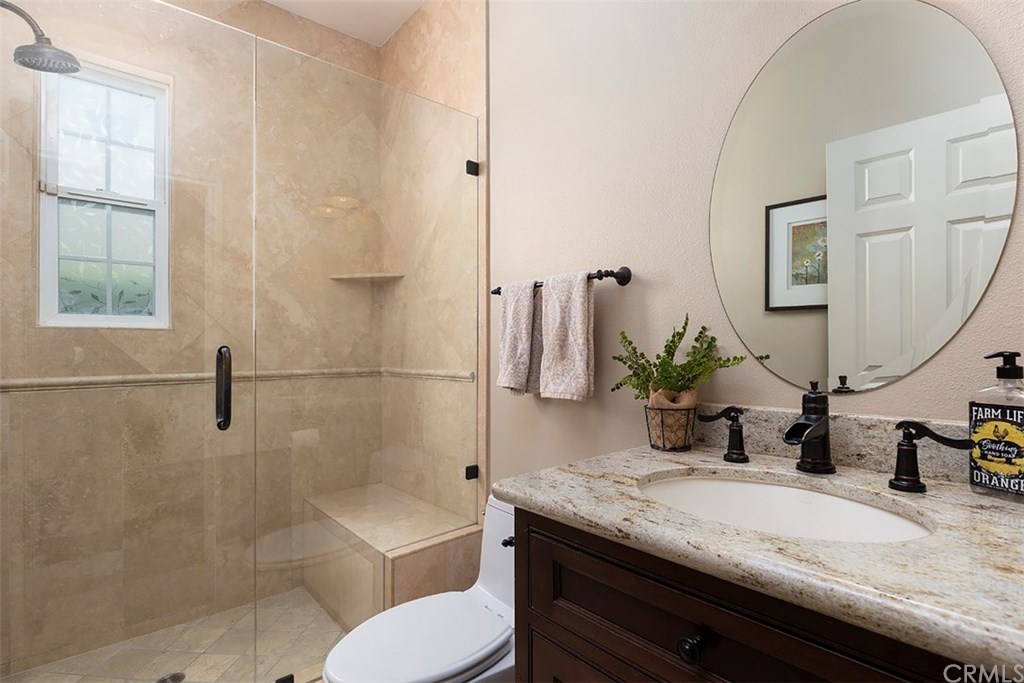 20 Winfield Drive Ladera Ranch, CA 92694 - Photo 19 of 47 Downstairs guest bathroom with upgraded stone shower and granite sink ~