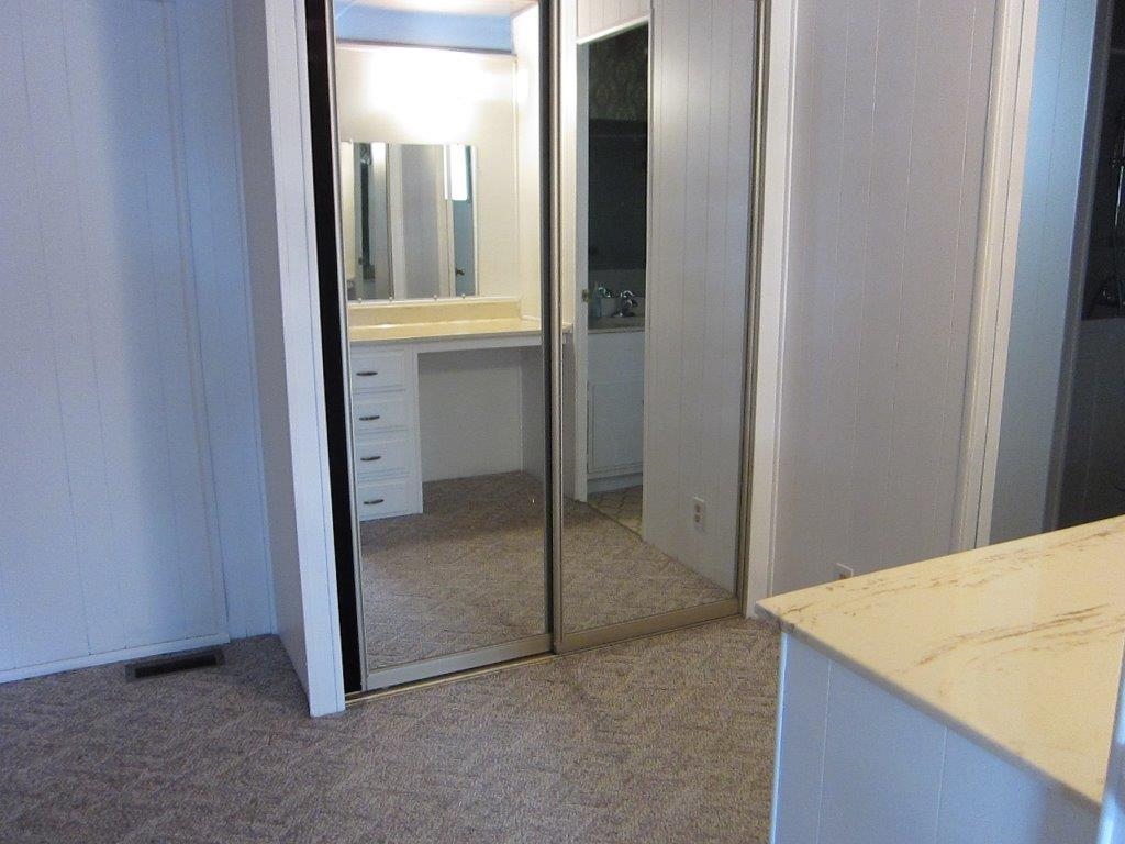 1925 Otay Lakes Road, Unit 87 Chula Vista, CA 91913 - Photo 18 of 25 Lovely dressing area off the MBR with great closets and a vanity counter with a mirror.