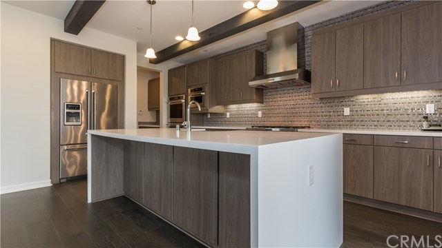 3 Baliza Road Rancho Mission Viejo, CA 92694 - Photo 1 of 1 The stainless steel appliances include double ovens, DW, Microwave, 6 burner gas stove, refrigerator, farm sink and hood.
