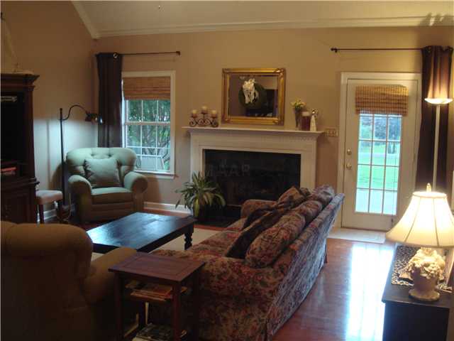Feel the warmth and coziness of this great room with its vaulted ceiling and gas log fireplace. Beautiful hardwood flooriing. Wired for surround sound.
