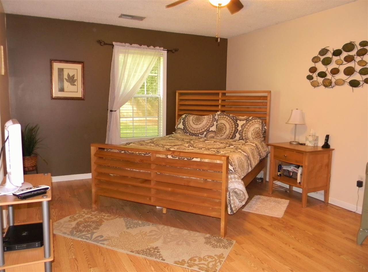173 Rene Street Brighton, TN 38011 - Photo 5 of 11 If you were hoping for a quiet room for the master suite, this is it. Located in the back of the home. Dark brown accent wall with soothing cream surrounding walls makes for a very beautiful room. Laminate flooring. Lg. walk-in closet.