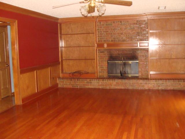 4146 Old Forest Road Memphis, TN 38125 - Photo 6 of 10 Beautiful hardwood flooring, built-ins, paneled walls and fireplace - who could ask for anything more?