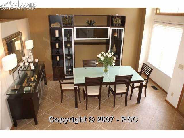 7215 Julynn Road Colorado Springs, CO 80919 - Photo 2 of 12 You are greeted by this stunning Dining/Living Room.