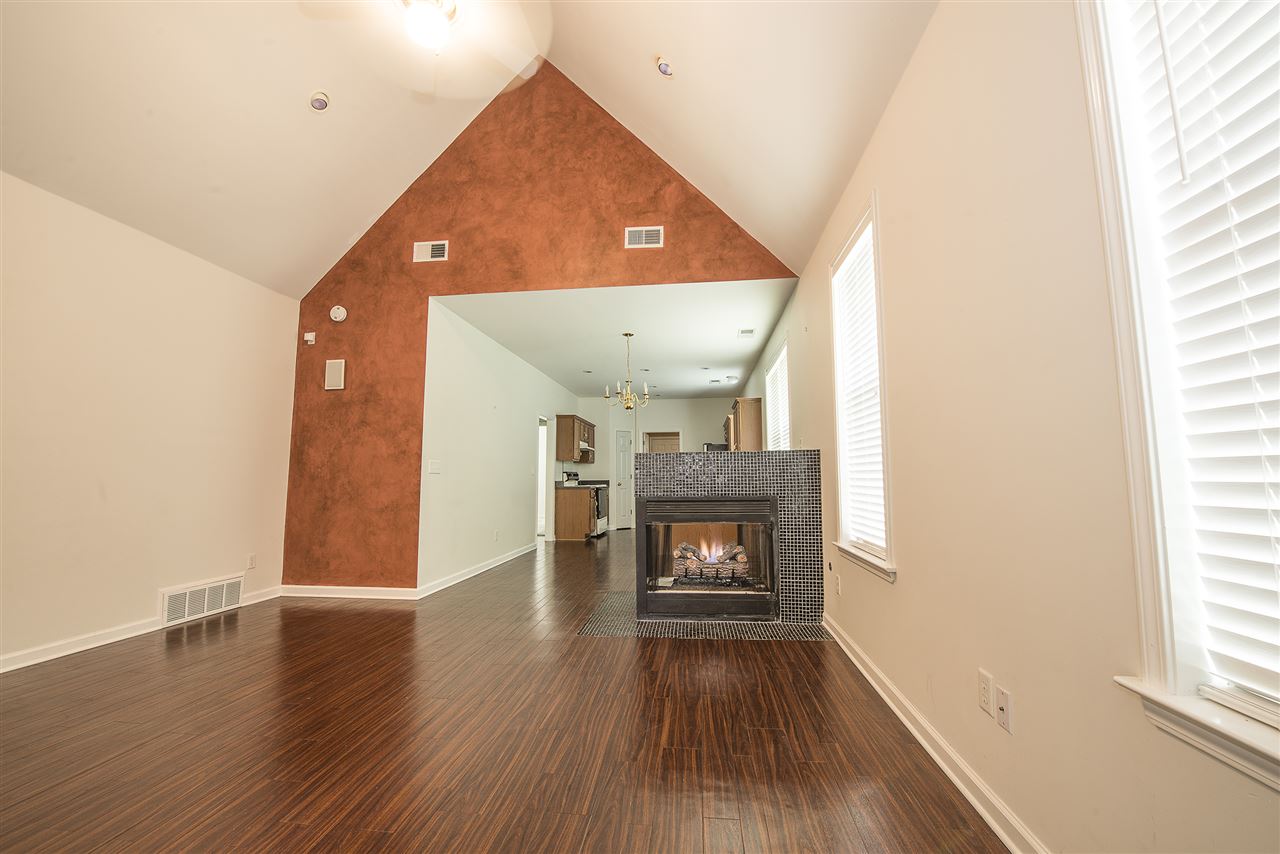 1237 Misty Isle Drive Memphis, TN 38103 - Photo 3 of 22 Spacious living room features high vaulted ceilings with recessed lights. Really opens up the front of the home.