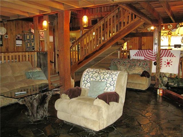 317 Woods Road Portland, TN 37148 - Photo 1 of 10 Living Room has slate floors, stone fireplace and open to second story.
