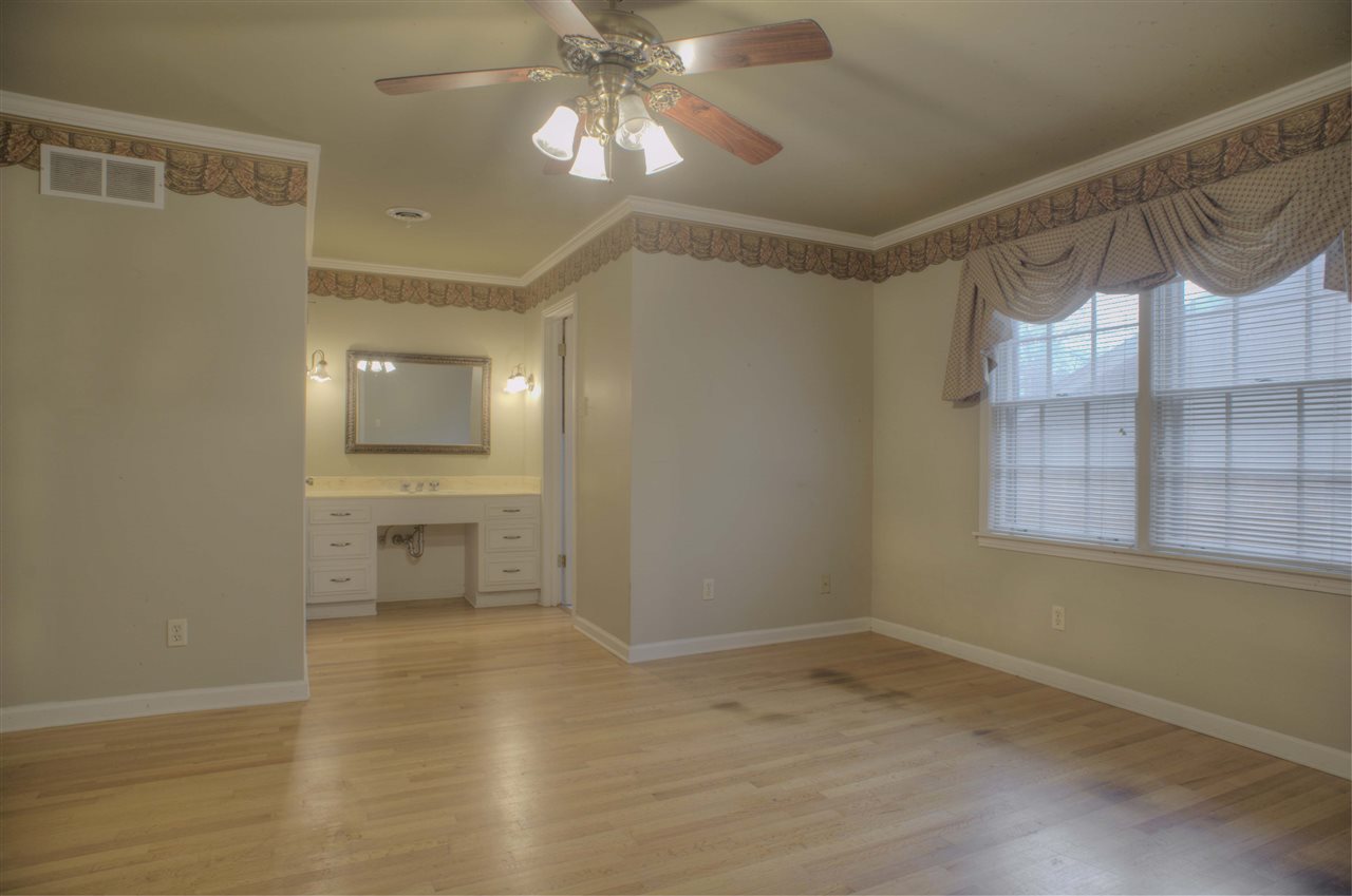 389 McElroy Road Memphis, TN 38120 - Photo 13 of 23 Spacious 16x11 Master Bedroom with Vanity, Ceiling Fan, Double Closet PLUS Walk-In and Private Bath