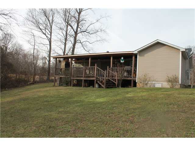 175 Montgomery Road Burlison, TN 38015 - Photo 4 of 13 42x12 covered deck with fireplace...the perfect hangout for those cool nights