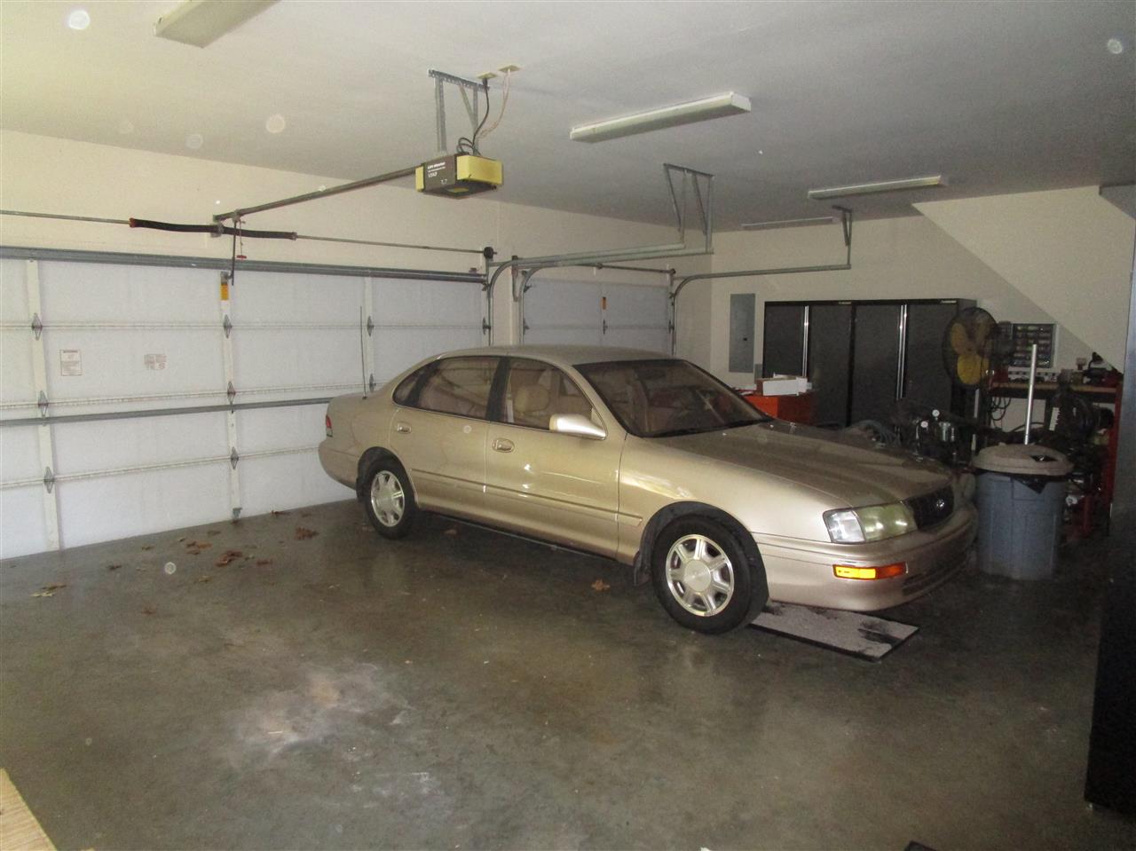 8180 Hines Road Millington, TN 38053 - Photo 19 of 22 Three car garage laid out well with workshop area by third bay. Utility sink in garage too for easy cleanup.