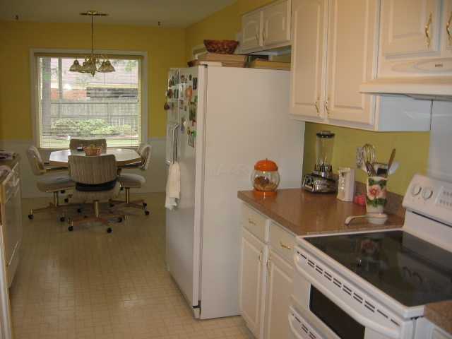 Goodlooking kitchen!  This view is from the dining room toward the breakfast area.  New double oven stove on the right.