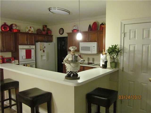 8943 Raspberry Lane Cordova, TN 38016 - Photo 5 of 15 Kitchen is equipped with a double oven, cooktop and built in microwave