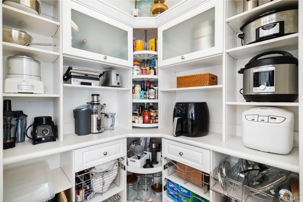 116 Mosswood Irvine, CA 92620 - Photo 6 of 42 The large pantry features lots of shelving to store and organize your appliances and supplies.