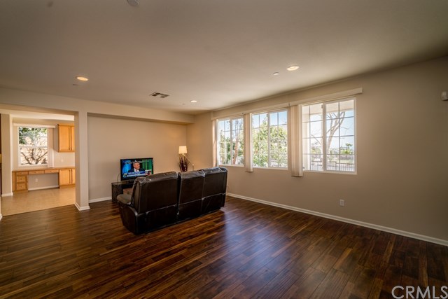 5473 Stoneview Road Rancho Cucamonga, CA 91739 - Photo 9 of 56 Large family room, laminate flooring, recessed lighting