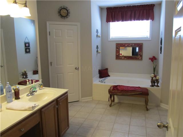 4771 Rainy Pass Road Collierville, TN 38017 - Photo 7 of 25 The master bathroom has his & her vanities, whirlpool tub, seperate shower, & large walk-in closets.
