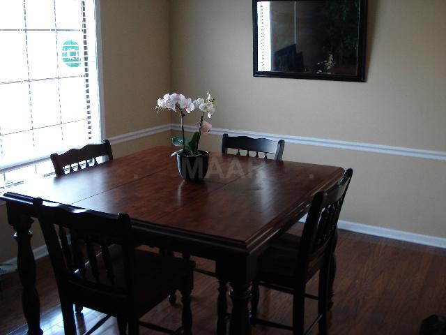 7625 Reese Road Memphis, TN 38133 - Photo 2 of 5 The dining room has wonderful hardwood flooring and flows into the huge great room. Perfect for fam