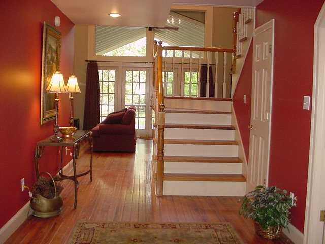 668 Rocky Point Road Memphis, TN 38018 - Photo 2 of 9 Enter from the brick covered front porch to the warm richness of reclaimed pine floors. A Tennesse plan formal dining on one side and study adjoining the master on the other. This wide foyer says "welcome" family & fiends.