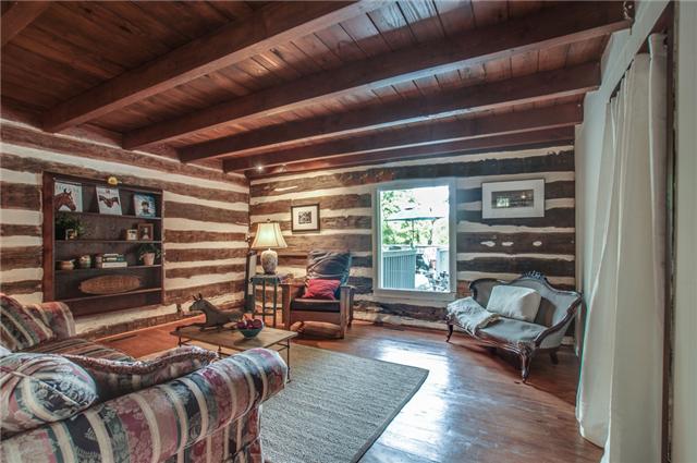 2147 Osburn Road Arrington, TN 37014 - Photo 28 of 30 Bedroom 2 on the main level has the original logs. It also would make a cool office or man cave.