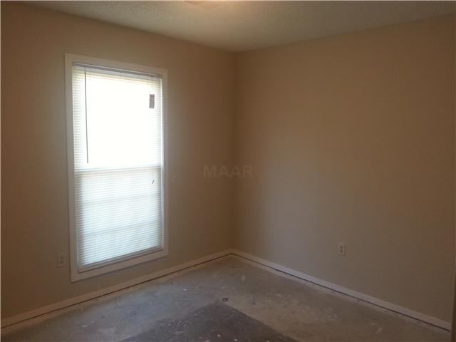 6977 Crestridge Road Memphis, TN 38119 - Photo 11 of 13 The second bedroom has a window providing plenty of light and plenty of closet space