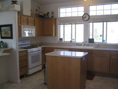 11552 Caliente Creek Road Caliente, CA 93518 - Photo 5 of 6 Natural oak cabinets, newer appliances and tiled flooring. Large pantry with pullouts, indoor laundry /utility room. All windows have solar screens. French doors, vaulted ceilings, multi-phone lines and surround system.