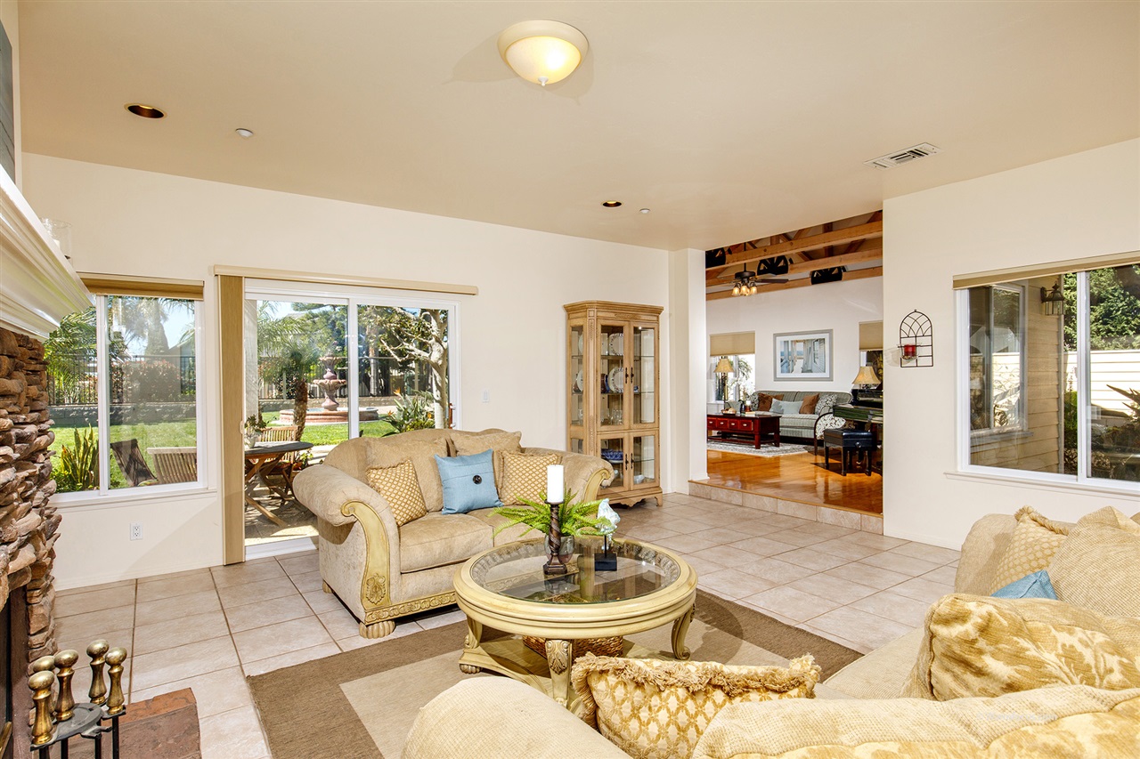 449 Ocean View Avenue Encinitas, CA 92024 - Photo 7 of 23 Bright family room with double sided fireplace