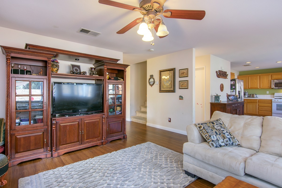 369 Spring Canyon Way Oceanside, CA 92057 - Photo 8 of 25 Family room with ceiling fan. Bamboo wood floors.