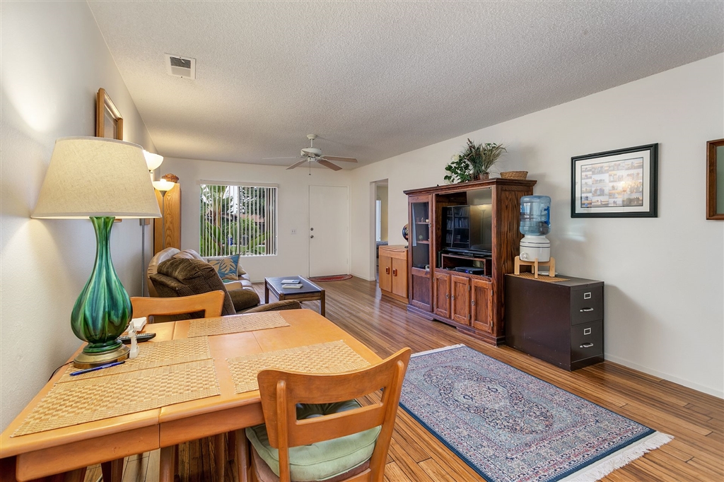 1387 Peacock Boulevard Oceanside, CA 92056 - Photo 5 of 15 View from dining area off kitchen looking across living room towards front door.