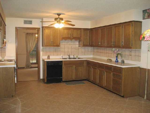 5689 Yale Road Bartlett, TN 38134 - Photo 4 of 8 The chef in your family will love the open feel of this fantastic Eat-in Kitchen featuring ceramic tile floors, tile backsplash, and ample cabinet space.