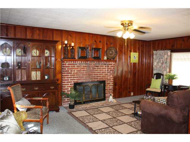 1084 Tatum Road Memphis, TN 38122 - Photo 5 of 12 Large Den with brick fireplace and picutre window overlooking rear yard. Lots of room to spread out!