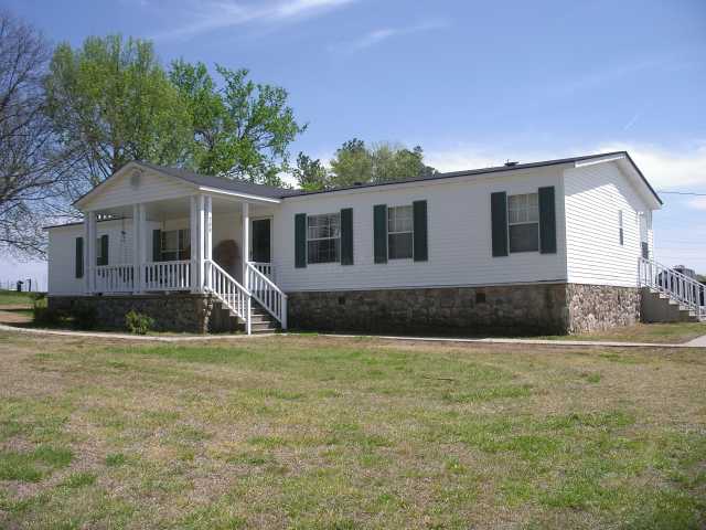 755 Whaley Road Covington, TN 38019 - Photo 1 of 10 Lovely mobile home with permanent foundation and underpinned with man-made stone.
