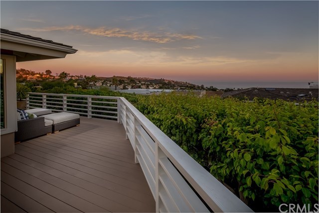 1588 Skyline Drive Laguna Beach, CA 92651 - Photo 18 of 18 Spacious wrap-around deck for entertaining, dining and relaxing, with ocean, sunset and twinkling lights hillside views of magical Laguna Beach.