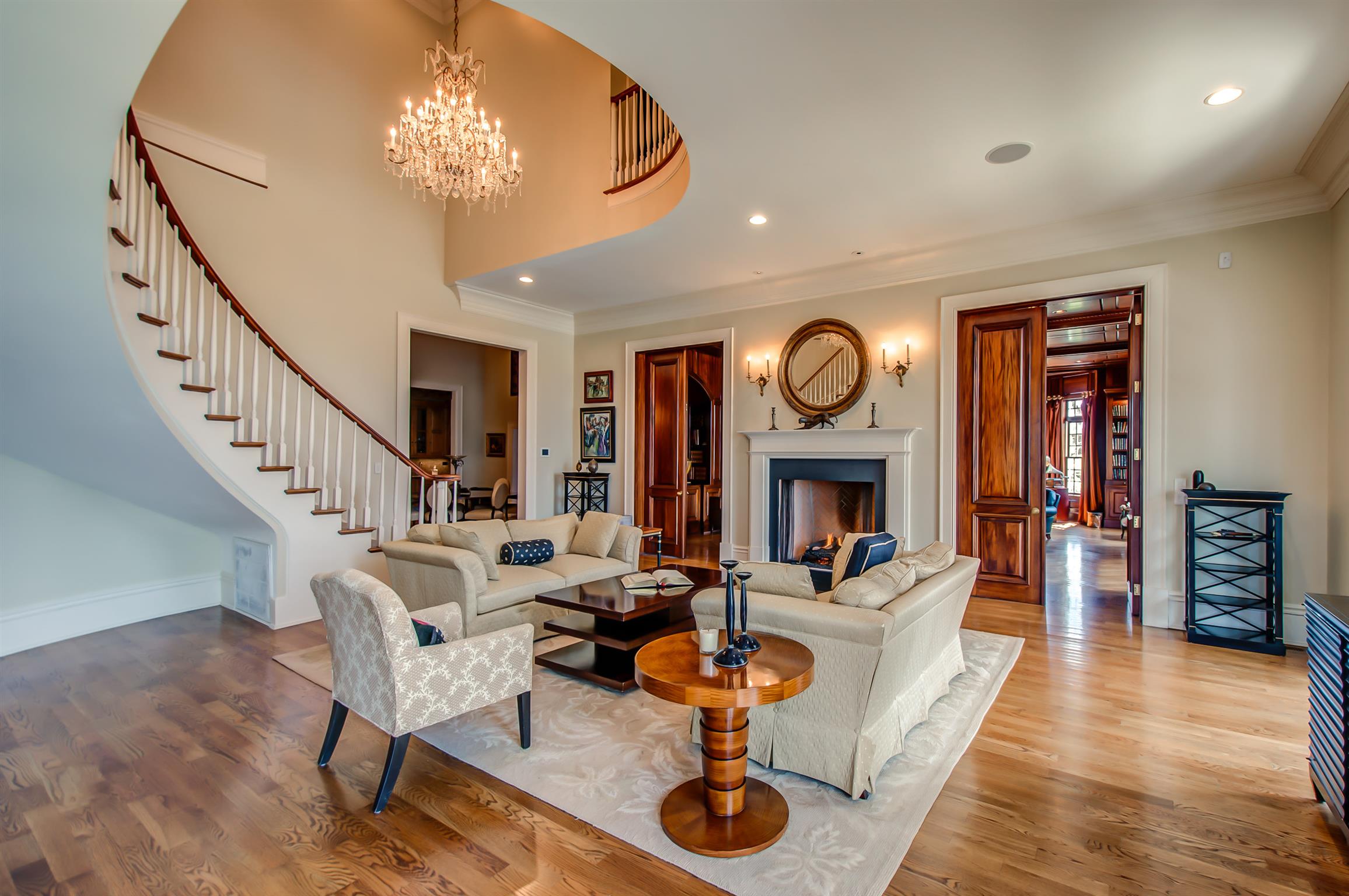 340 Kinnie Road Franklin, TN 37069 - Photo 3 of 28 Beautiful entry "parlor" featuring lovely staircase, gas log fireplace, gorgeous chandelier...