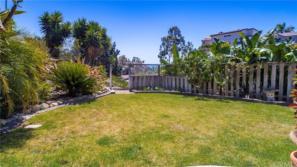 34096 El Contento Dana Point, CA 92629 - Photo 5 of 43 Truly a rare and amazing opportunity to own a quintessential Lantern Village beach bungalow situated atop one of the largest LOTS in the area with OCEAN and Whitewater vistas!