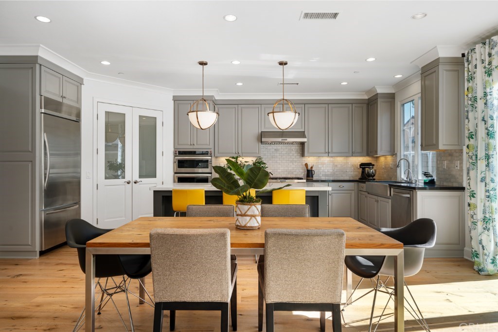 116 Mosswood Irvine, CA 92620 - Photo 7 of 42 Alternative view of the dining area and kitchen.